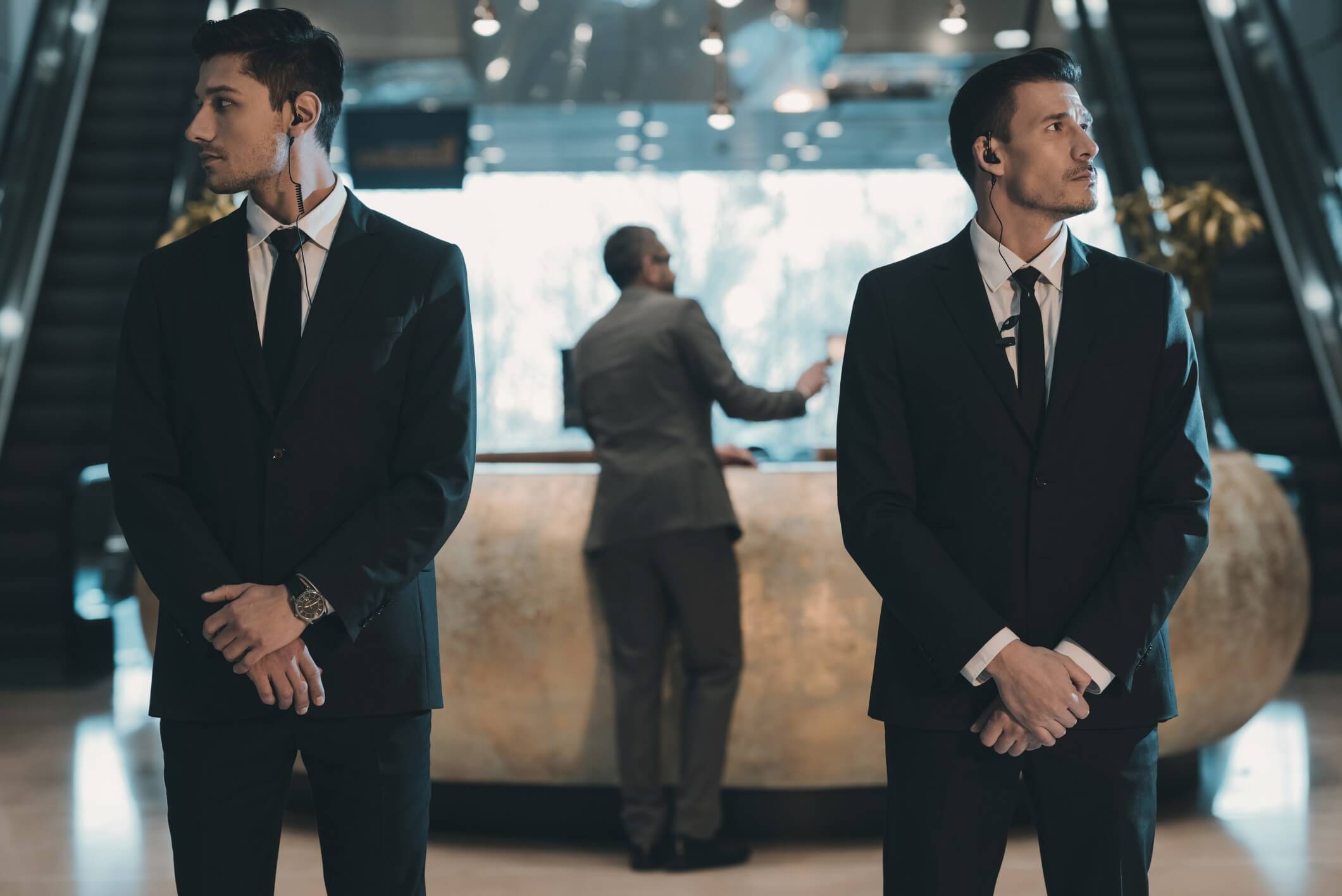 two security guards protecting their client
